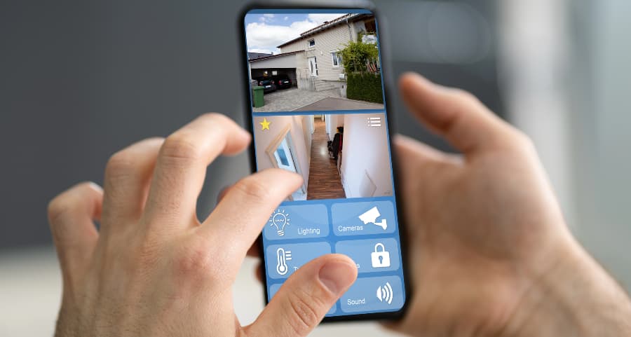 Homeowner checking surveillance camera footage on a smartphone