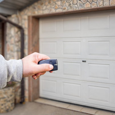 Baton Rouge security key fob pointing to a garage door